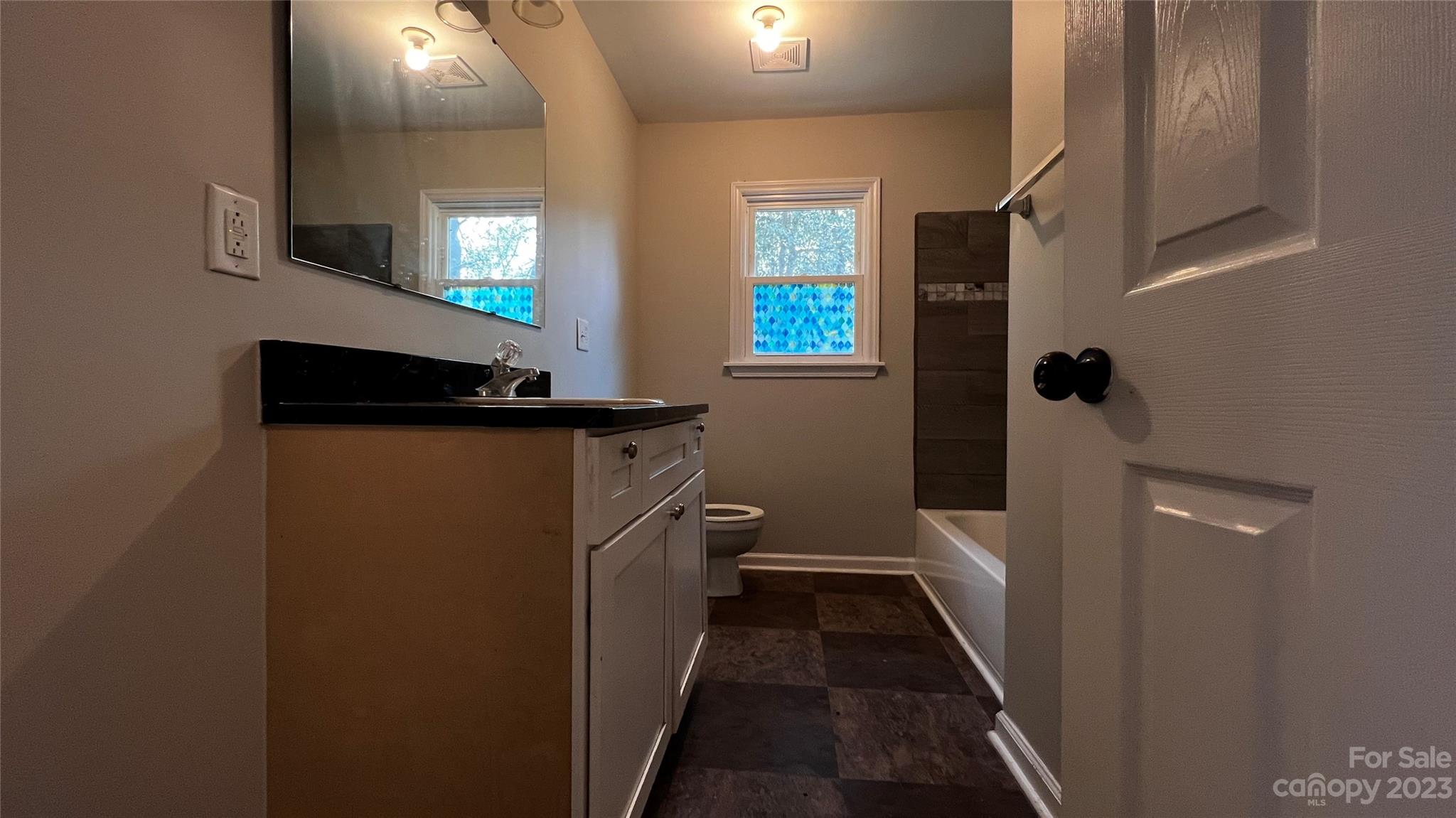 1919 Petty Road Shelby, NC 28150 - Photo 11 of 12 a bathroom with a sink a toilet and a mirror