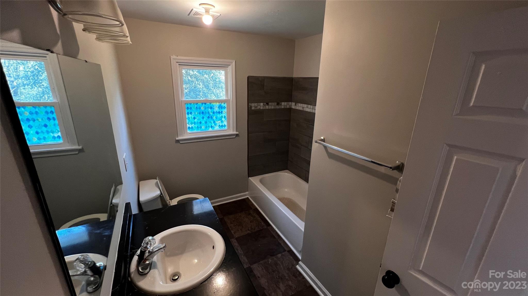 1919 Petty Road Shelby, NC 28150 - Photo 12 of 12 a bathroom with a toilet washing machine and a mirror