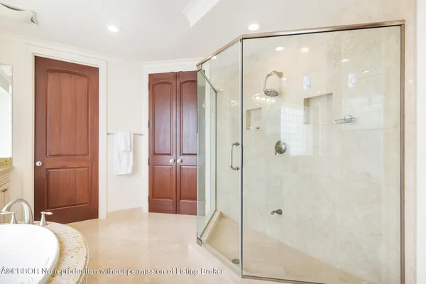 a bathroom with a shower and a sink