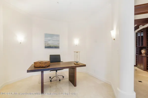 a workspace with furniture and a lamp