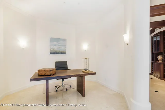 a workspace with furniture and a lamp