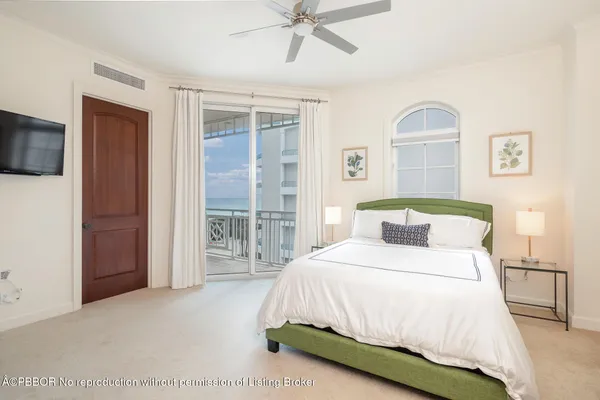 a bedroom with a bed and a television