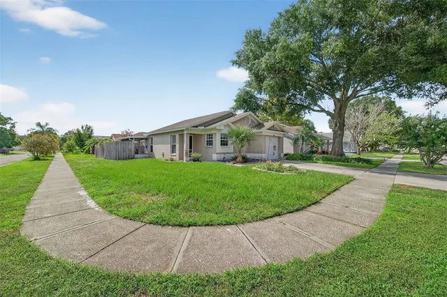 a view of a house with a yard