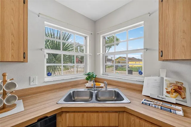 a kitchen with a sink and a window