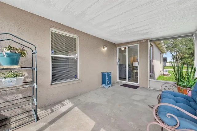 a view of a livingroom with furniture and windows