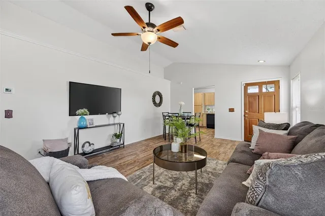 a living room with furniture and a flat screen tv