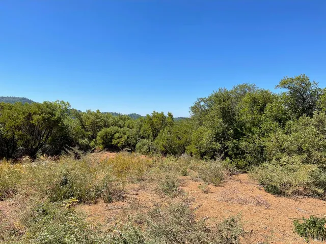 a view of a snow covered with snow in the background