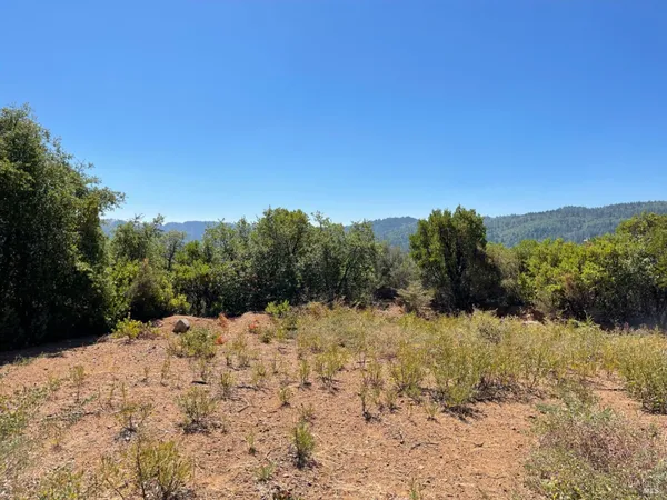 a view of a lake with mountains in the background