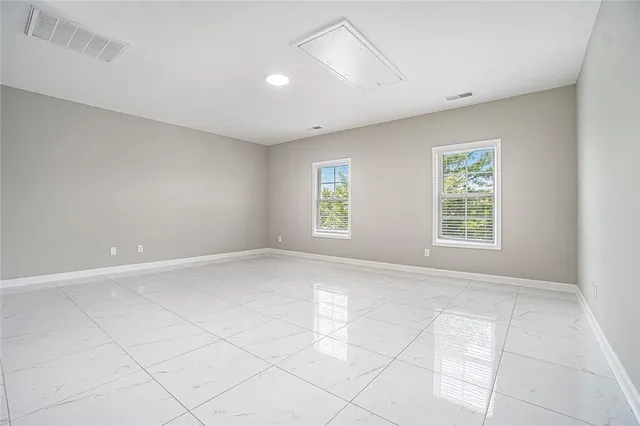 an empty room with windows