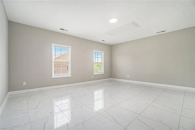 an empty room with windows