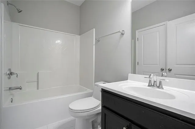 a bathroom with a sink a toilet and a bathtub