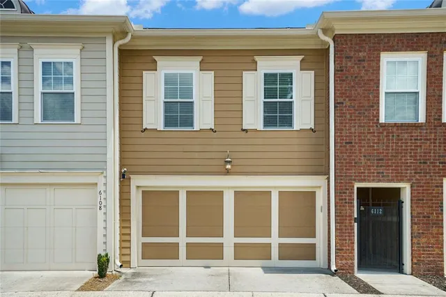 a view of a brick house with a large windows