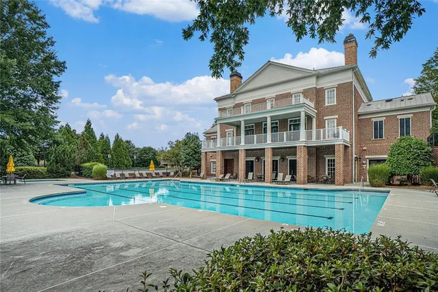 a view of a house with a yard and plants