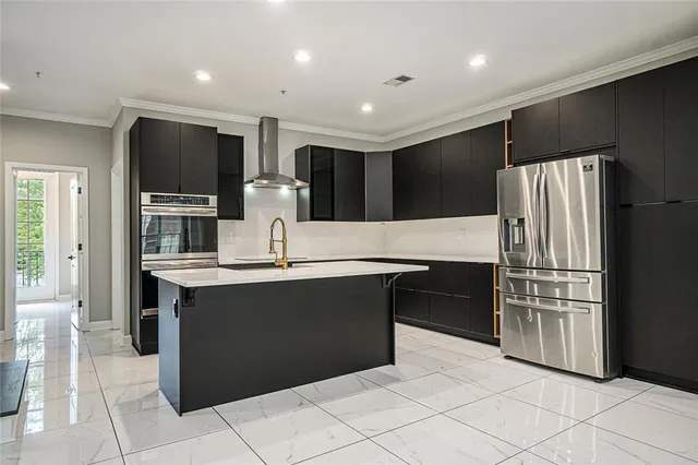 a kitchen with a refrigerator and a sink