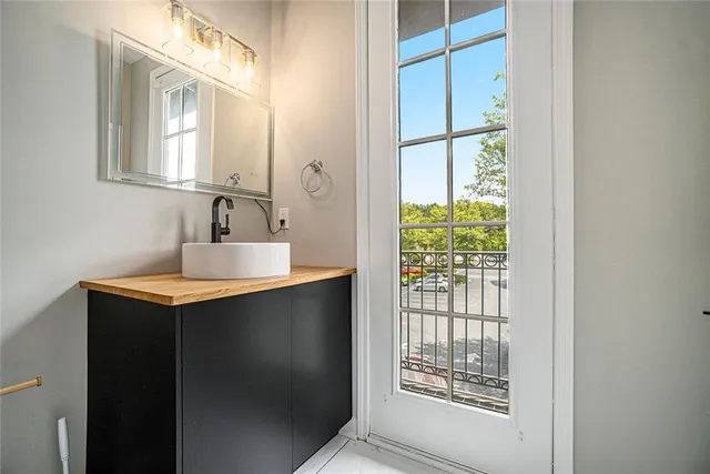 a bathroom with a sink and a mirror