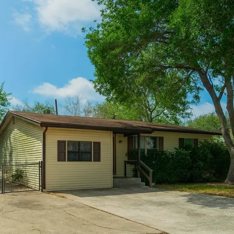a view of front door and yard