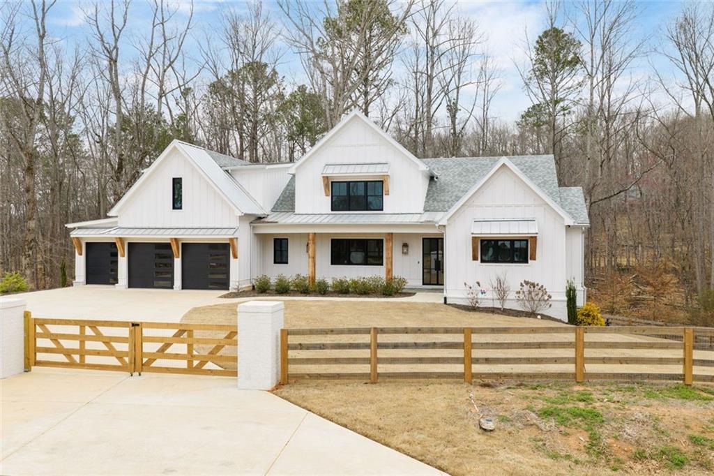 555 Lower Birmingham Road Canton, GA 30115 - Photo 95 of 104 a front view of a house with a yard