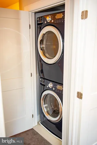 a bedroom with a bed and chair