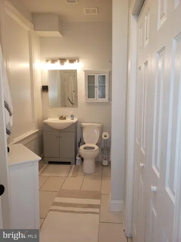 a bathroom with a sink a mirror and a shower