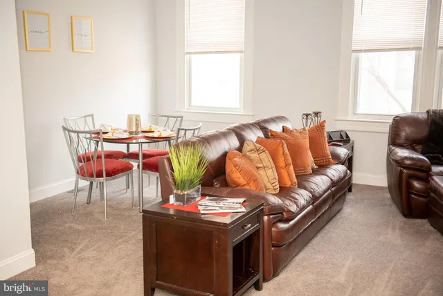 a living room with a couch and a table