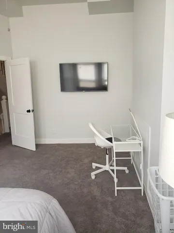 a bathroom with a toilet a sink and a window