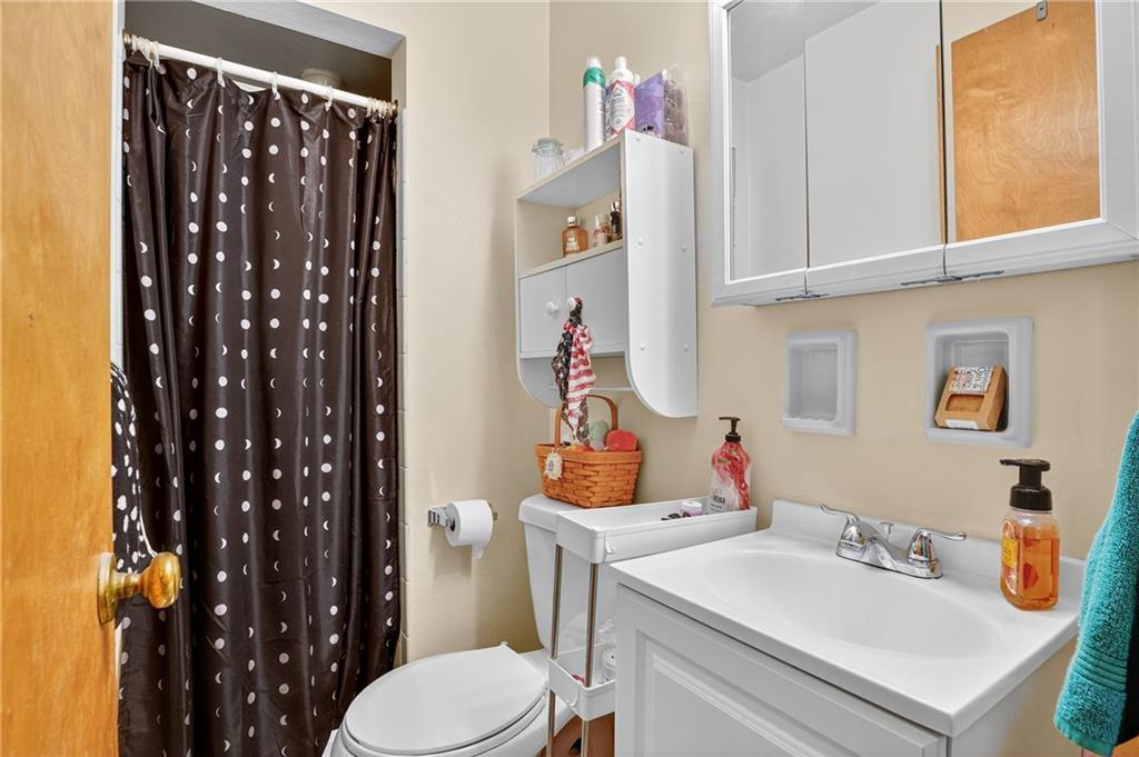 718 West Ingomar Road Pittsburgh, PA 15237 - Photo 18 of 40 a bathroom with a sink vanity mirror and toilet