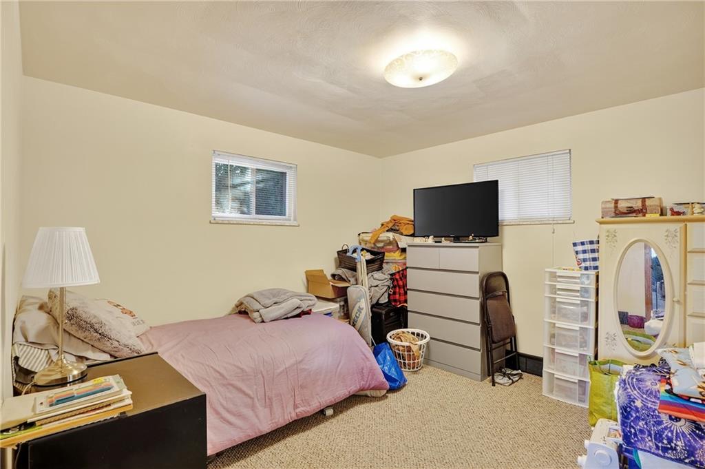 718 West Ingomar Road Pittsburgh, PA 15237 - Photo 20 of 40 a bedroom with bed and tv