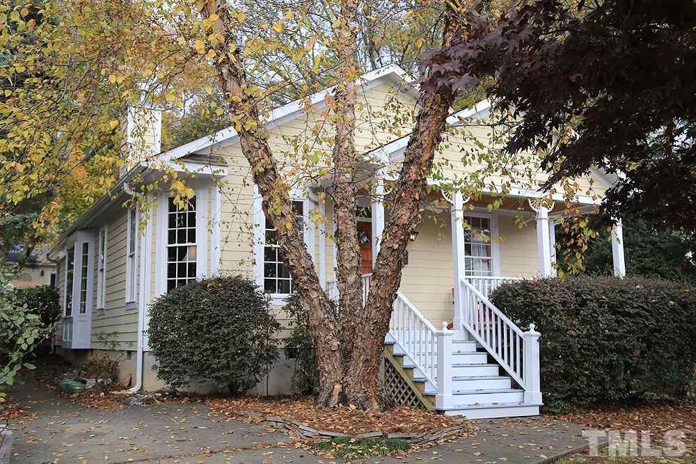 1802 Reaves Drive Raleigh, NC 27608 - Photo 1 of 22 a front view of a house with trees