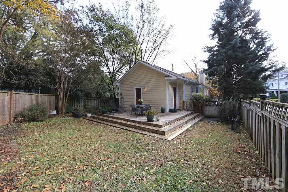 1802 Reaves Drive Raleigh, NC 27608 - Photo 5 of 22 a view of a house with backyard and a tree