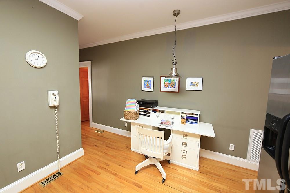1802 Reaves Drive Raleigh, NC 27608 - Photo 8 of 22 a workspace with furniture and window