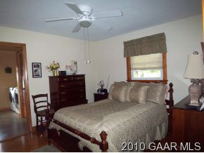 2747 Lyndhurst Road Waynesboro, VA 22980 - Photo 6 of 8 a bedroom with a large bed and a dresser