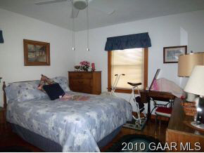 2747 Lyndhurst Road Waynesboro, VA 22980 - Photo 7 of 8 a bed room with a bed and a chair