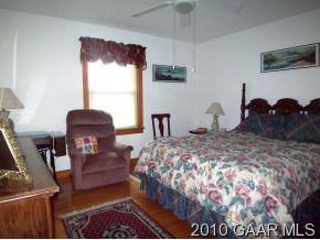 2747 Lyndhurst Road Waynesboro, VA 22980 - Photo 8 of 8 a bed sitting in a bedroom next to a window