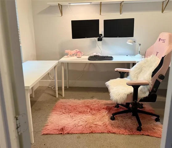 a workspace with furniture and bathroom