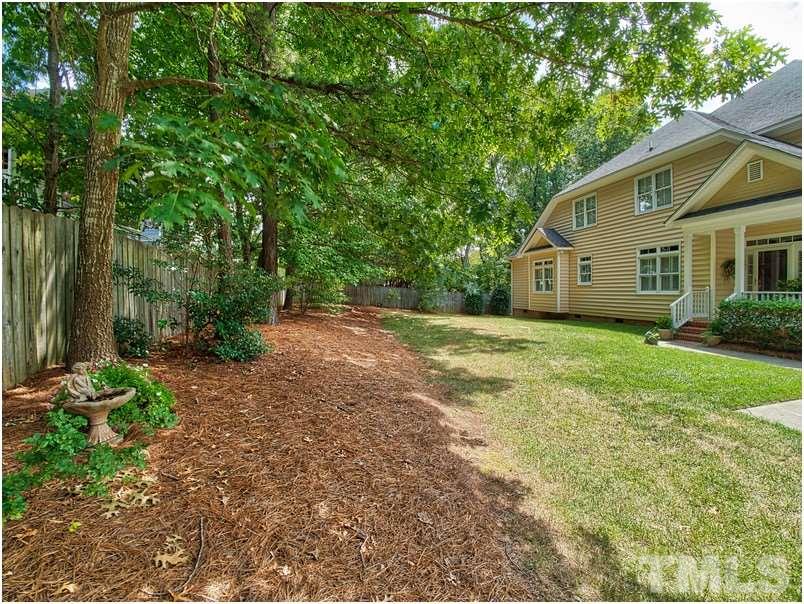 9012 Carrington Ridge Drive Raleigh, NC 27615 - Photo 2 of 22 a view of a house with backyard and garden
