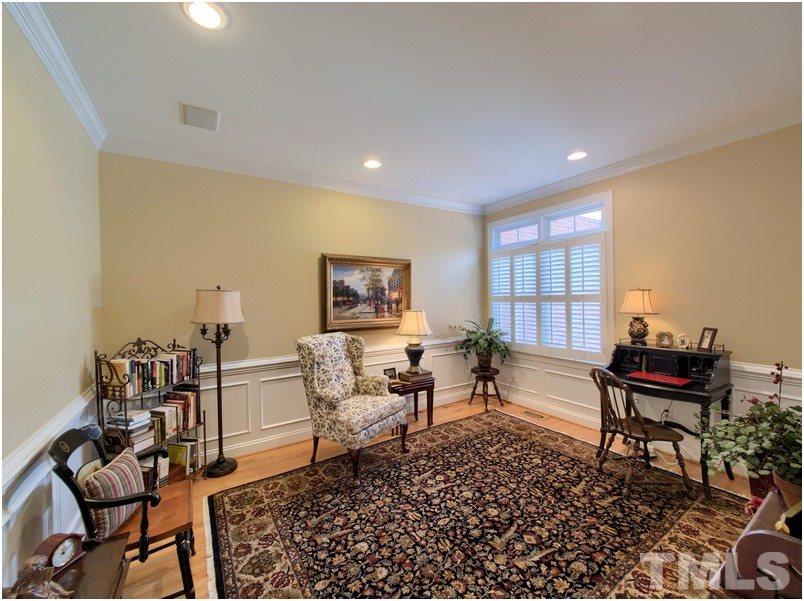 9012 Carrington Ridge Drive Raleigh, NC 27615 - Photo 16 of 22 a living room with furniture a piano and a rug
