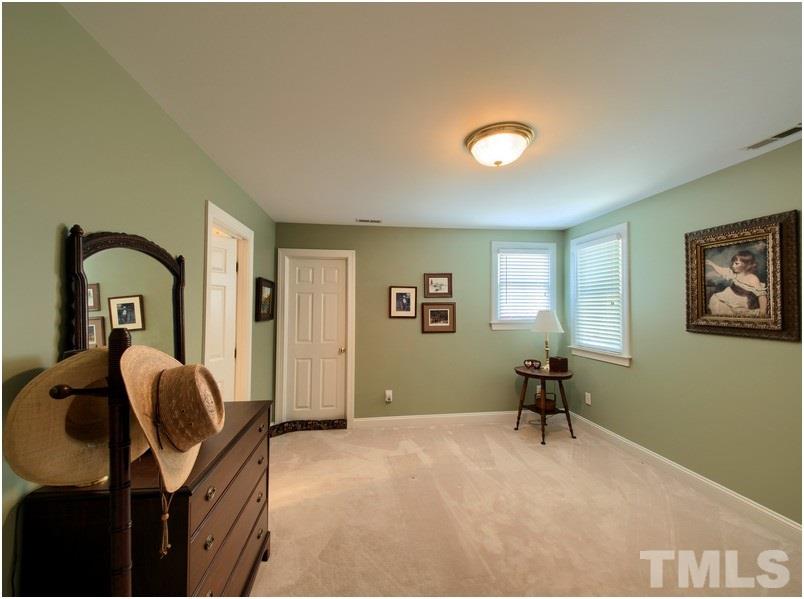 9012 Carrington Ridge Drive Raleigh, NC 27615 - Photo 18 of 22 a living room with furniture and a window