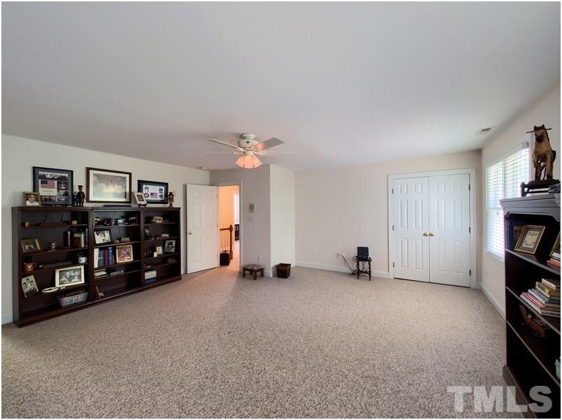 9012 Carrington Ridge Drive Raleigh, NC 27615 - Photo 20 of 22 a view of an empty room with a window and a cabinet
