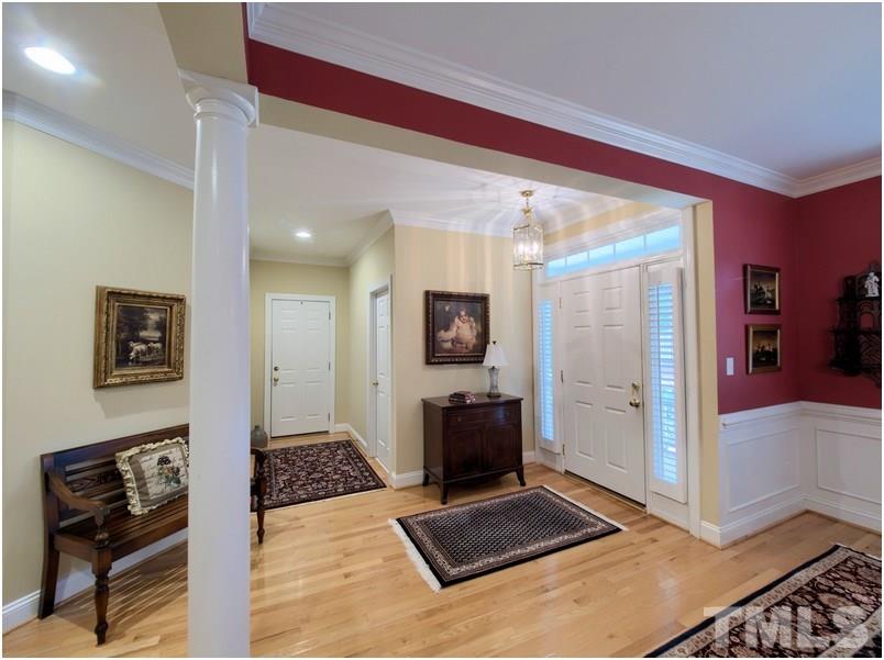 9012 Carrington Ridge Drive Raleigh, NC 27615 - Photo 4 of 22 a living room with furniture and a flat screen tv