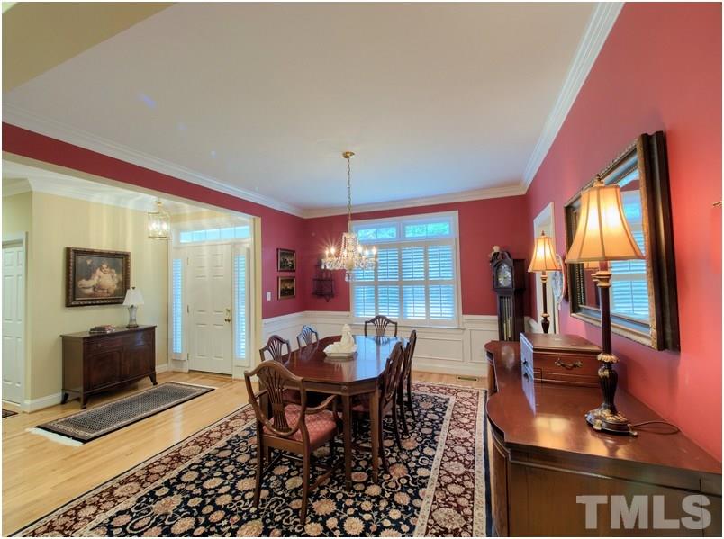 9012 Carrington Ridge Drive Raleigh, NC 27615 - Photo 6 of 22 a view of a dining room with furniture