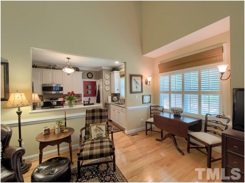9012 Carrington Ridge Drive Raleigh, NC 27615 - Photo 9 of 22 a living room with furniture and a large window