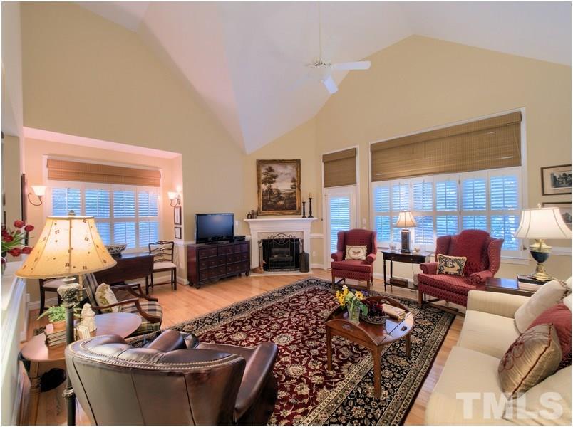 9012 Carrington Ridge Drive Raleigh, NC 27615 - Photo 10 of 22 a living room with fireplace furniture and a fireplace