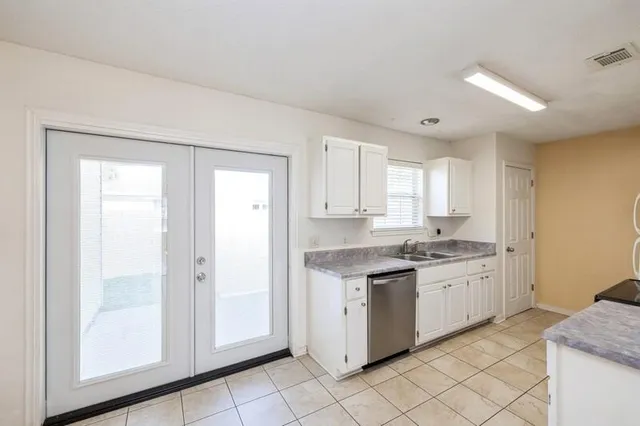 a kitchen with a stove a sink and a refrigerator