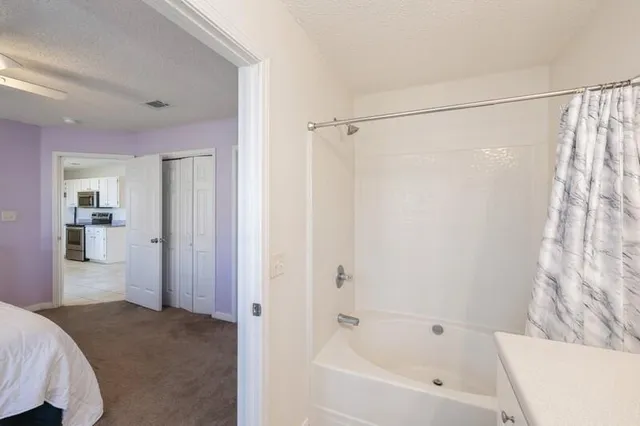 a bathroom with a bathtub and a shower