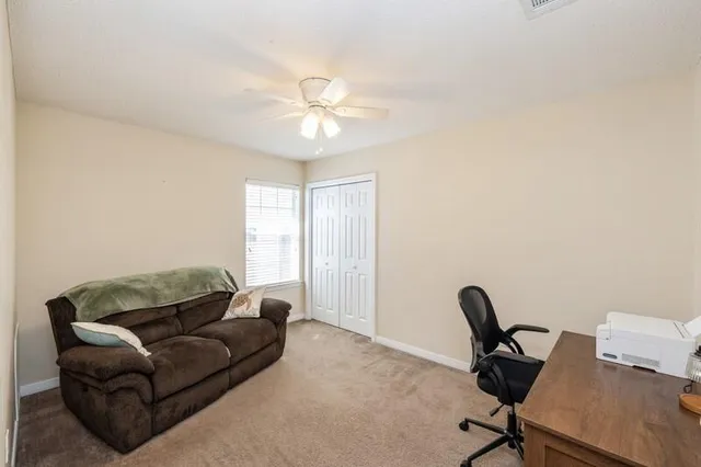 a living room with furniture and a window