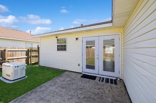 a view of a backyard with plants and a garden