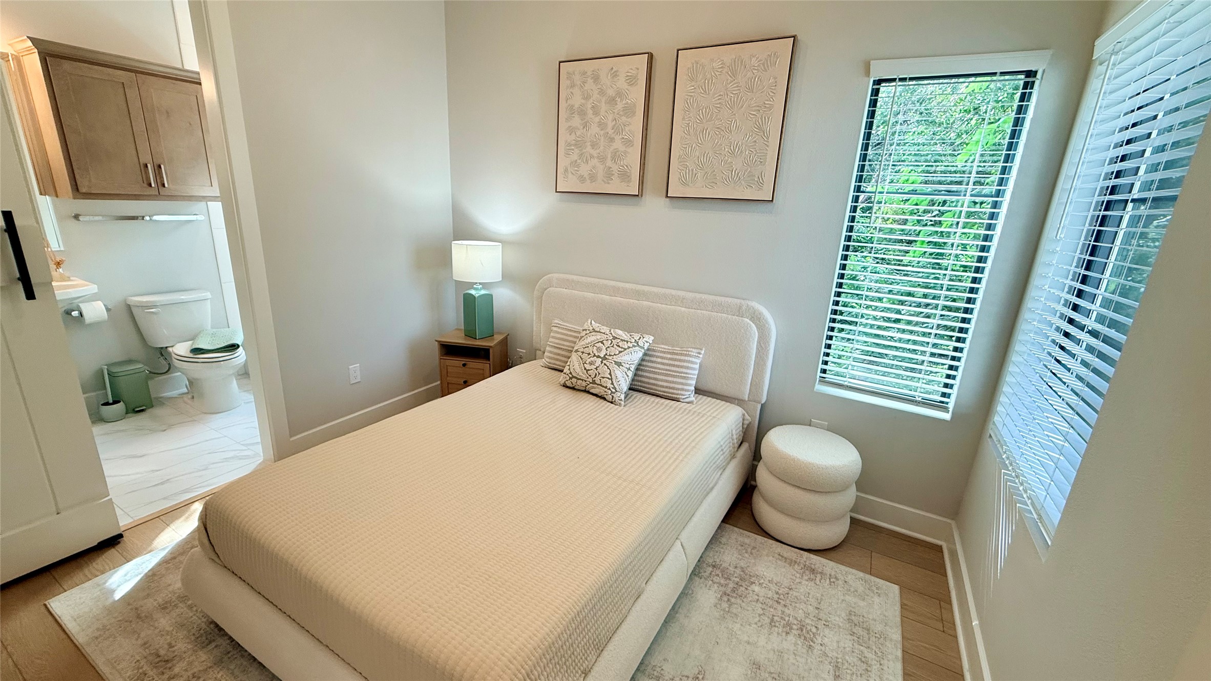 114 Lightsey Road, Unit 2 Austin, TX 78704 - Photo 12 of 14 A well-appointed bedroom suite features ample natural light and convenient en-suite access.