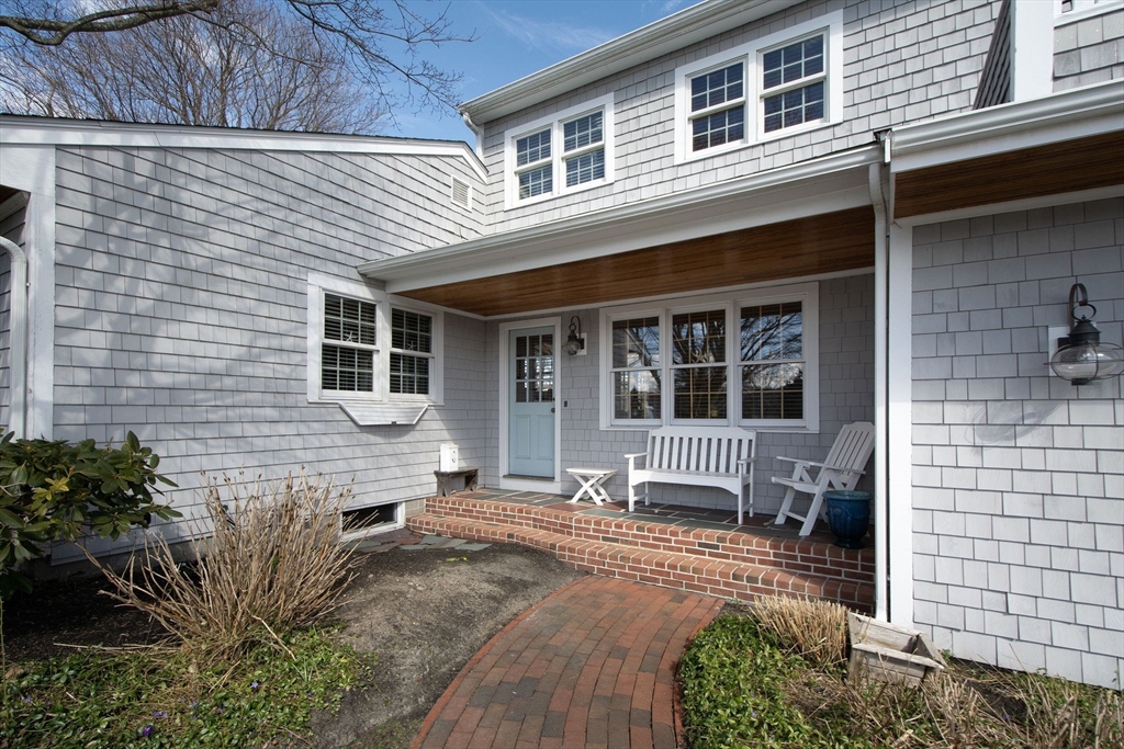 26 Bay Ridge Road Scituate, MA 02066 - Photo 3 of 11 a front view of a house with outdoor seating