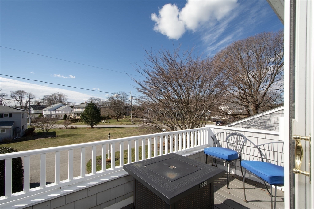 26 Bay Ridge Road Scituate, MA 02066 - Photo 8 of 11 a view of a chairs and table on the terrace