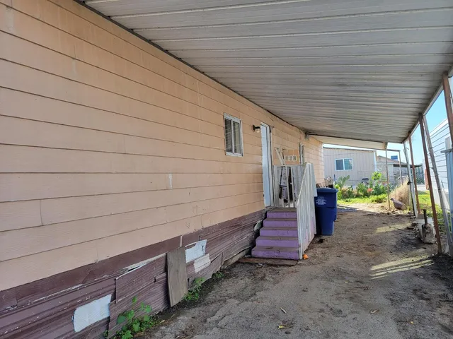 a view of backyard with seating space